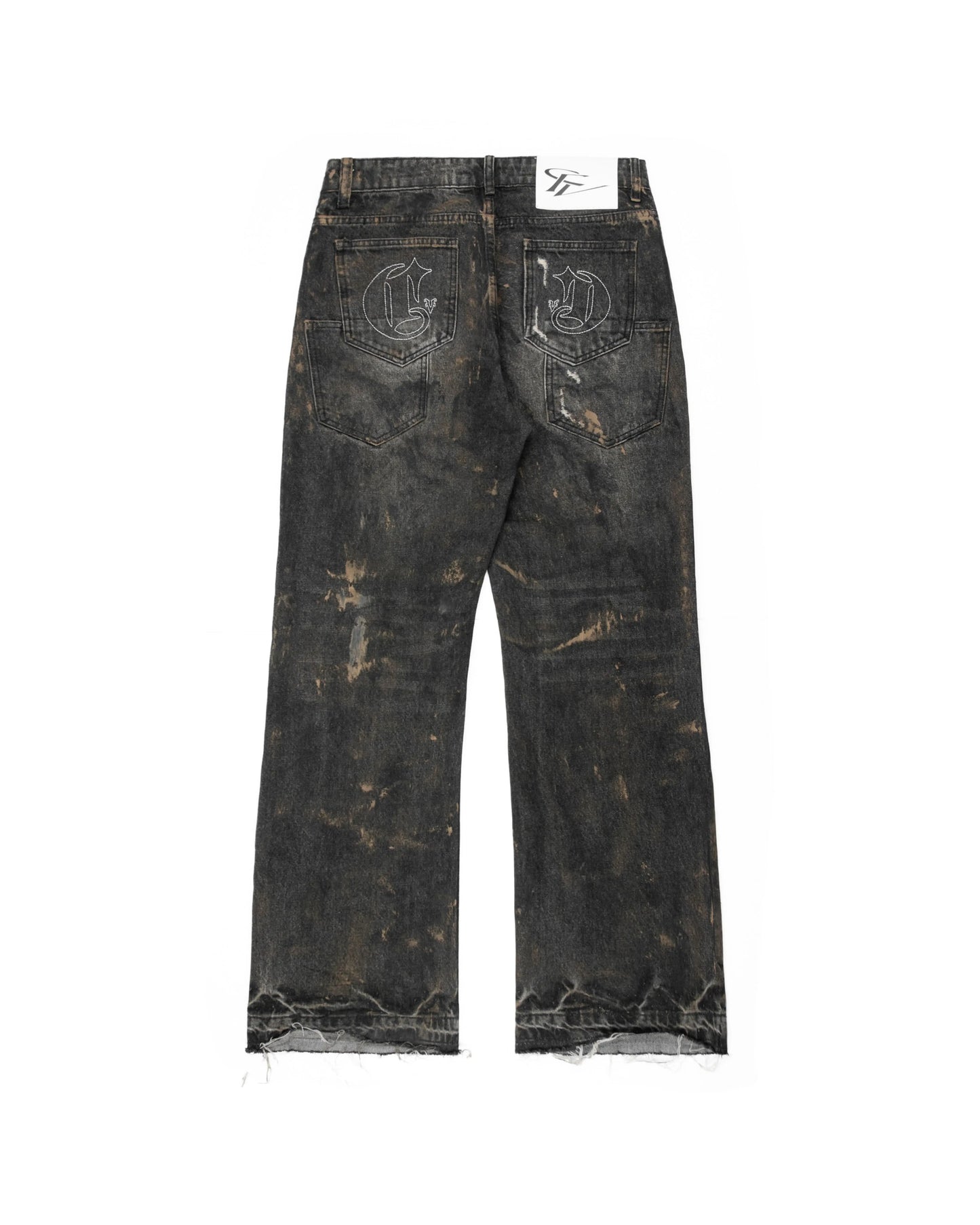 Distressed black denim jeans with a relaxed, bootcut fit . The jeans feature a heavily worn aesthetic, including brown splatter-style detailing, embroidery on both back pockets and frayed hems.