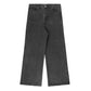 Black denim jeans with a subtle all-over leopard print pattern, featuring a high-waisted, wide-leg silhouette. The jeans include a classic five-pocket design, belt loops, and a branded metallic button closure.