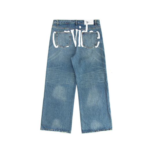 Blue washed out denim jeans, featuring 2 pockets on the back with a screen print detail behind the pockets. Including distressing marks on the knee. 