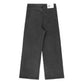 Black denim jeans with a subtle all-over leopard print pattern, featuring a high-waisted, wide-leg silhouette, belt loops, and a branded white leather tab.