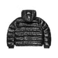 The back of a black puffer jacket with insulated down, water-resistant exterior, and zippered pockets, with a thick hood, perfect for winter weather