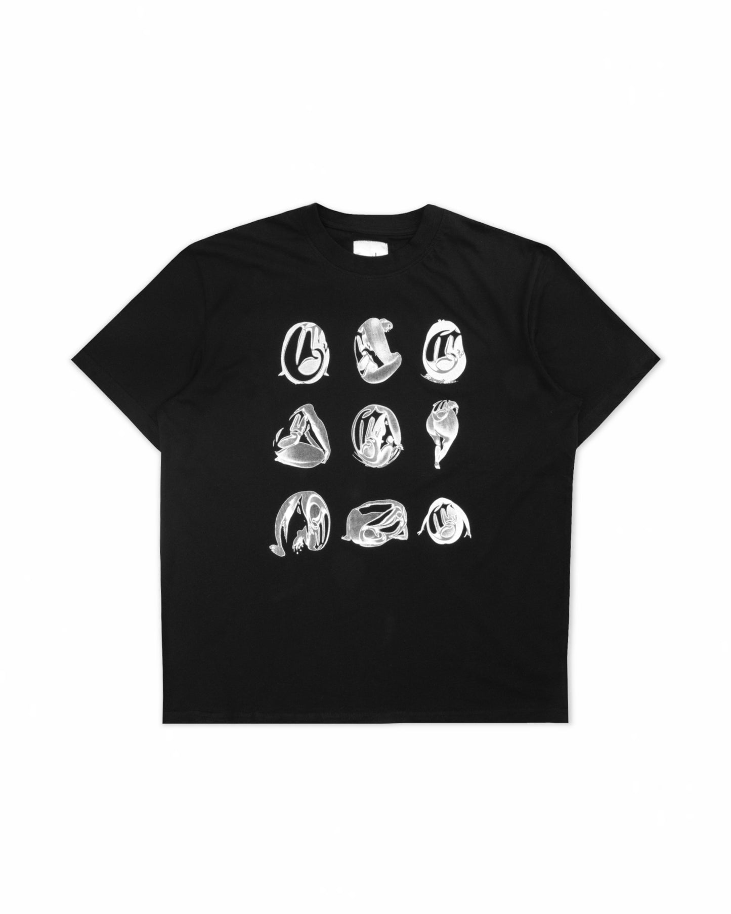 Black cotton T-shirt with a front-facing view, featuring a white abstract graphic design in a grid layout for a modern aesthetic.