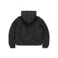 Back view of a black embossed puffer jacket showcasing a bold quilted pattern, detachable hood, and insulated design for cold-weather styling.