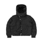 Front view of a black embossed puffer jacket featuring a detachable hood, asymmetrical zipper closure, and quilted design for a modern winter look.