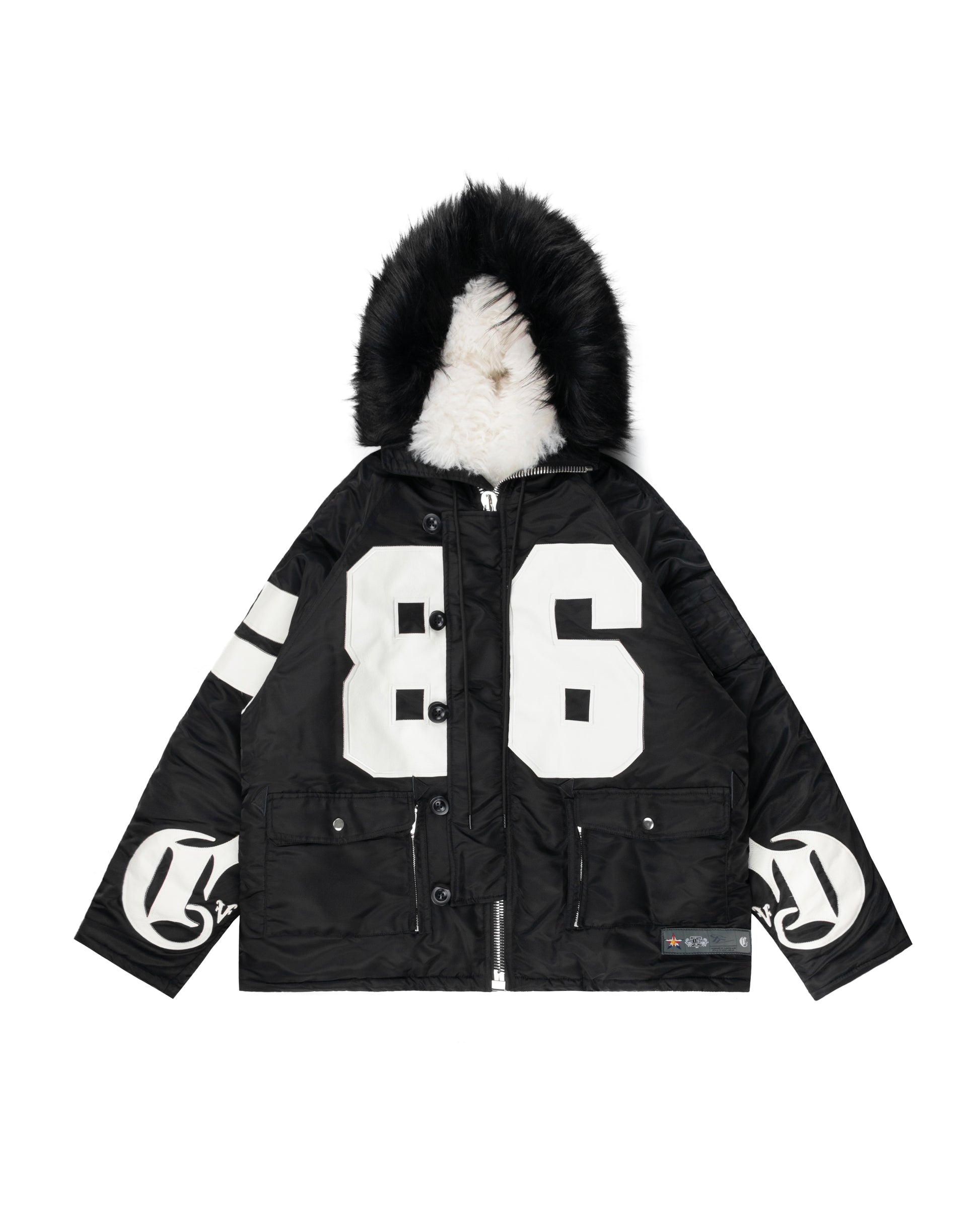 Black parka jacket featuring a faux fur-lined hood, bold white 86 design on the front, CRVDAE branding on the sleeves, and multiple utility pockets for a stylish winter look.