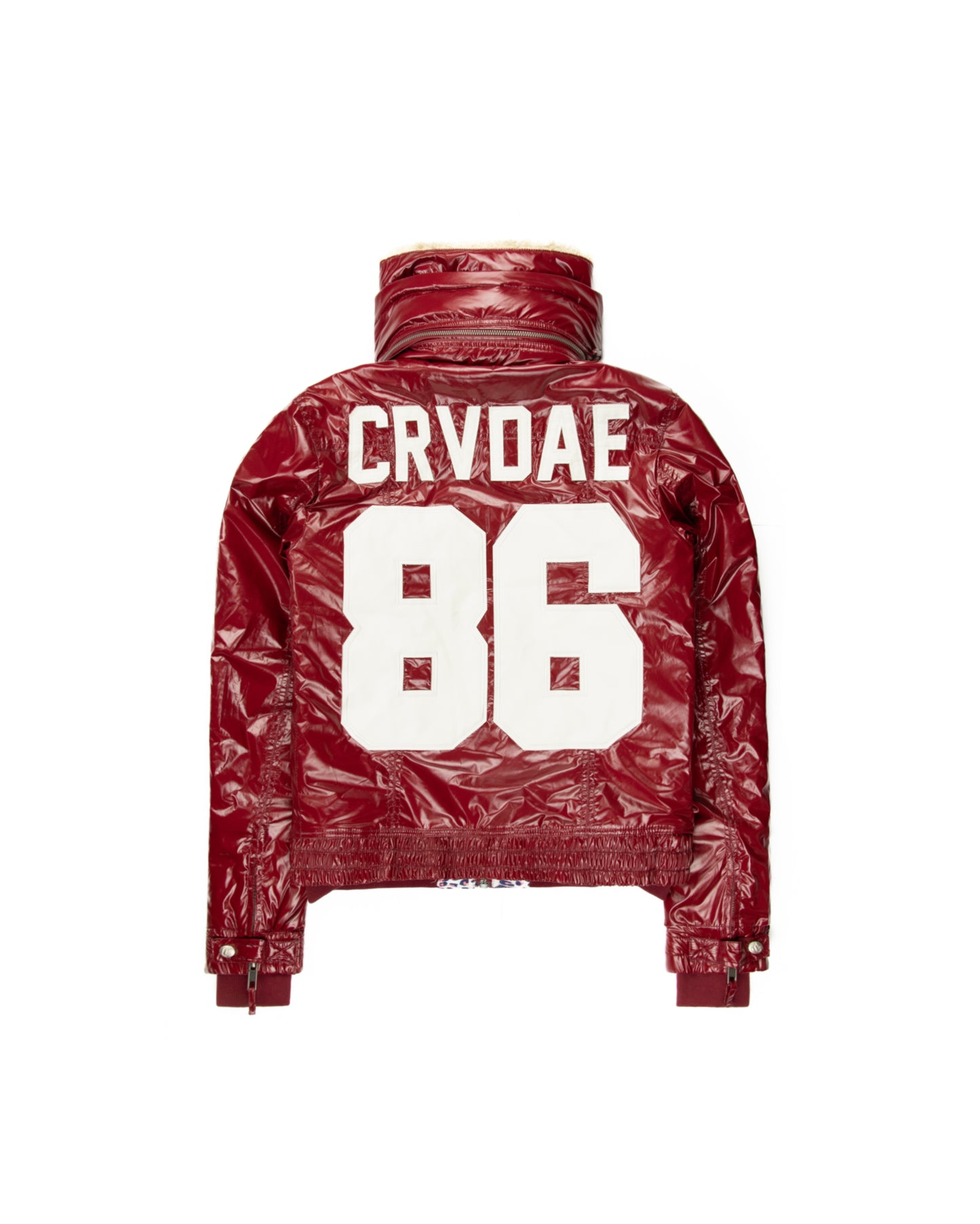 Back view of a burgundy faux leather jacket featuring bold white CRVDAE text and number 86 design, with a shiny finish and high-collar style.